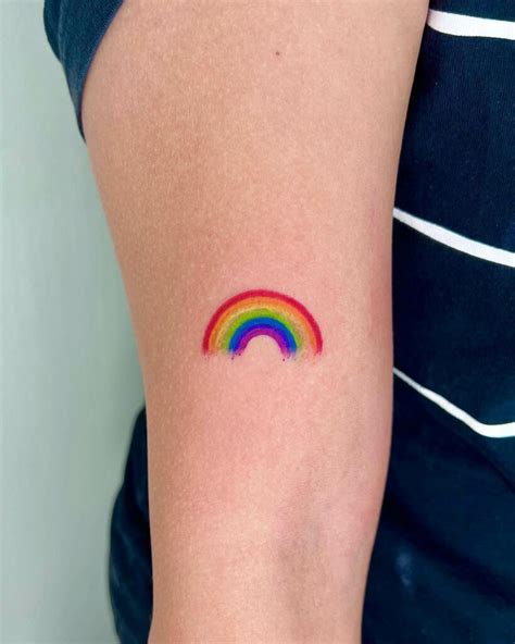 tiny rainbow tattoo|rainbow brite tattoo designs.